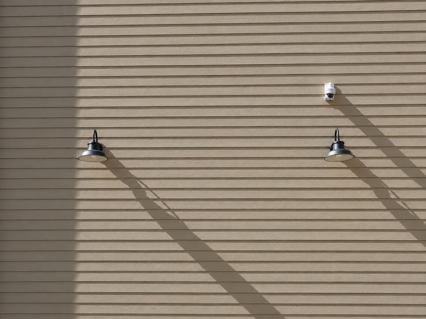 Horizontal lap siding with gooseneck wall lights